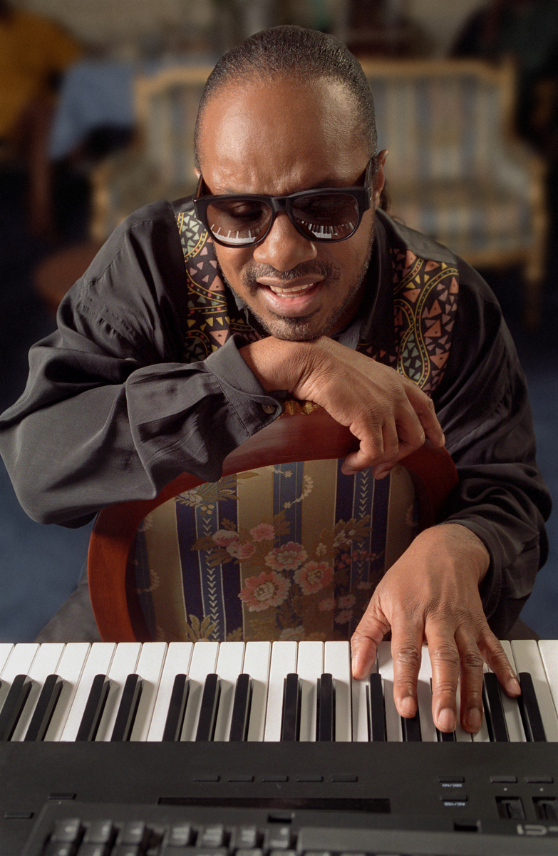 Stevie on NYC playing piano in his hotel suite NYC Freelance photographer