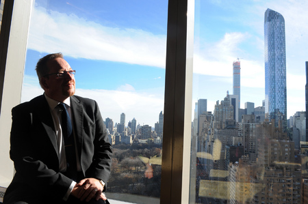 John Dicey, a businessman from London captured in NYC scenes, from window of Mandarin Orient hotel.

© Susan Farley/NYC photographer